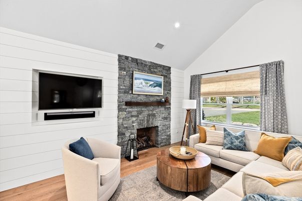 Fireplace, Interior, Living room, Recessed Lighting, Stone Walls, Wood Texture Flooring