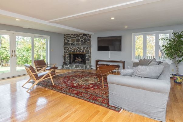 Fireplace, Interior, Living room, Recessed Lighting, Stone Walls, Wood Texture Flooring
