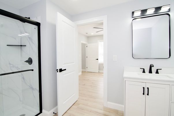 Bathroom, Glass Shower, Interior, Marble Walls, Recessed Lighting, Wood Texture Flooring