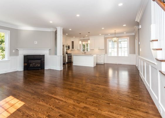 Empty room, Fireplace, Interior, Kitchen, Pendant Lights, Recessed Lighting, Stainless Steel Appliances, Wood Texture Flooring