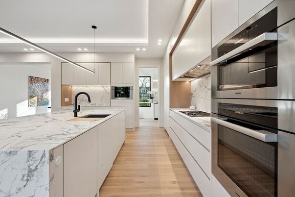 Interior, Kitchen, Marble Walls, Pendant Lights, Recessed Lighting, Stainless Steel Appliances, Wood Texture Flooring