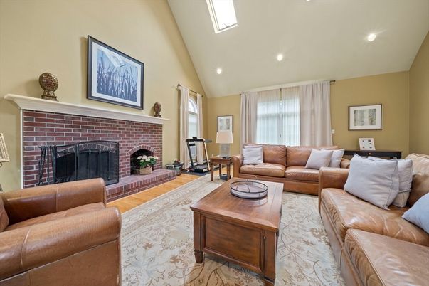 Fireplace, Interior, Living room, Recessed Lighting, Stone Walls, Wood Texture Flooring