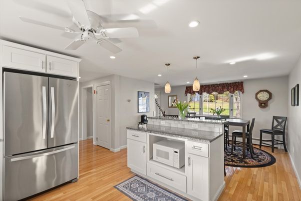 Dining room, Interior, Kitchen, Pendant Lights, Recessed Lighting, Stainless Steel Appliances, Wood Texture Flooring