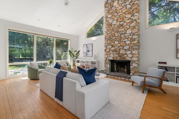 Fireplace, Interior, Living room, Recessed Lighting, Stone Walls, Wood Texture Flooring