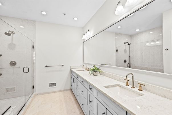 Bathroom, Dual Sink Vanities, Glass Shower, Interior, Marble, Marble Walls, Recessed Lighting