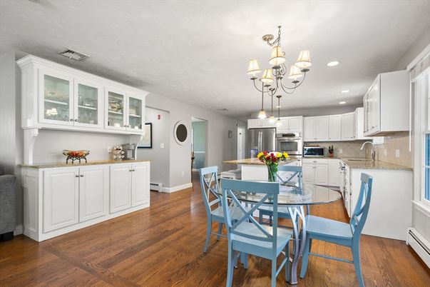 Chandelier, Dining room, Interior, Kitchen, Recessed Lighting, Stainless Steel Appliances, Wood Texture Flooring