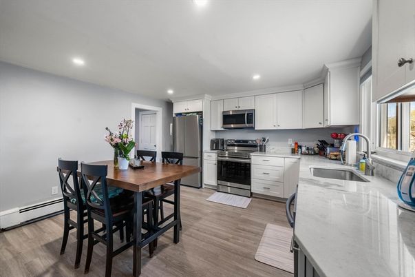 Dining room, Interior, Kitchen, Recessed Lighting, Stainless Steel Appliances, Wood Texture Flooring