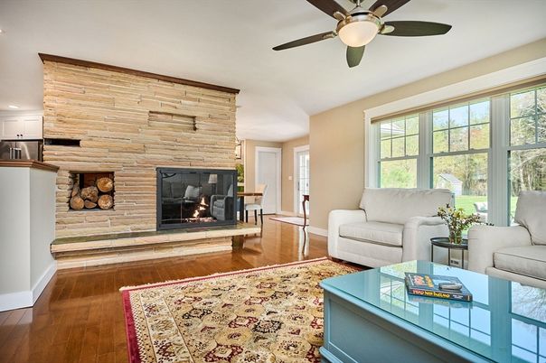 Fireplace, Interior, Living room, Recessed Lighting, Stone Walls, Wood Texture Flooring