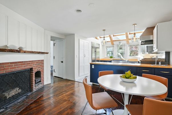 Dining room, Fireplace, Interior, Kitchen, Pendant Lights, Stainless Steel Appliances, Wood Texture Flooring