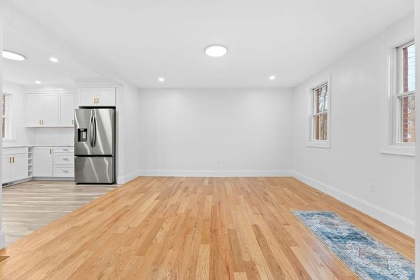 Empty room, Interior, Kitchen, Recessed Lighting, Stainless Steel Appliances, Wood Texture Flooring