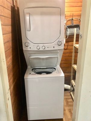 Interior, Utility Closets, Washer, Wood Texture Flooring, Wooden Walls
