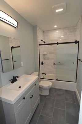 Bathroom, Dual Sink Vanities, Glass Shower, Interior, Marble Walls, Recessed Lighting