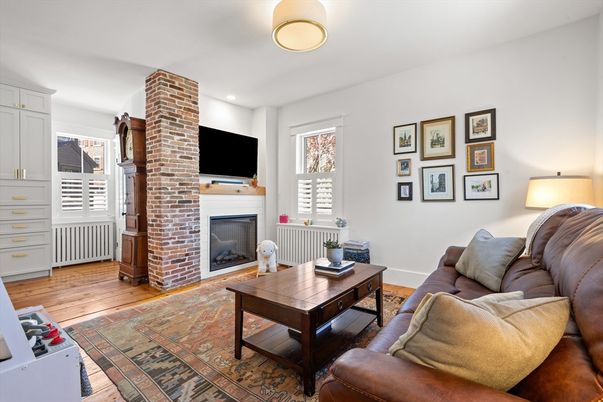 Fireplace, Interior, Living room, Recessed Lighting, Stone Walls, Wood Texture Flooring