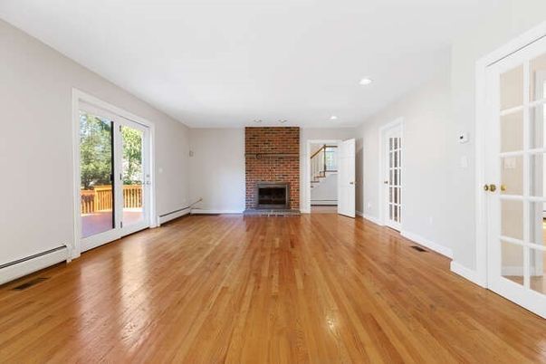 Empty room, Fireplace, Interior, Recessed Lighting, Stone Walls, Wood Texture Flooring