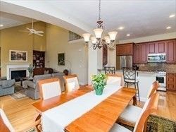 Chandelier, Dining room, Fireplace, Interior, Kitchen, Living room, Recessed Lighting, Stainless Steel Appliances, Wood Texture Flooring
