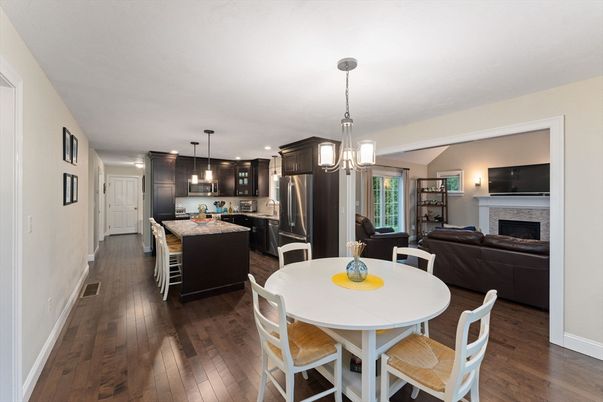 Dining room, Fireplace, Interior, Kitchen, Living room, Pendant Lights, Recessed Lighting, Stainless Steel Appliances, Wood Texture Flooring
