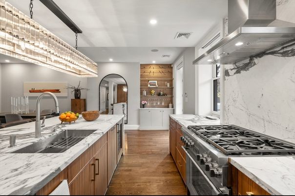 Chandelier, Interior, Kitchen, Marble Walls, Recessed Lighting, Stainless Steel Appliances, Wood Texture Flooring