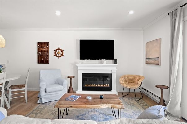 Dining room, Fireplace, Interior, Living room, Recessed Lighting, Wood Texture Flooring
