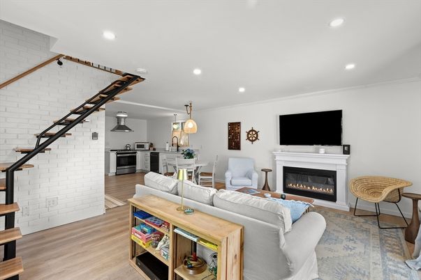 Dining room, Fireplace, Interior, Kitchen, Living room, Pendant Lights, Recessed Lighting, Stainless Steel Appliances, Stone Walls, Wood Texture Flooring