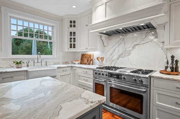 Interior, Kitchen, Marble Walls, Recessed Lighting, Stainless Steel Appliances, Wood Texture Flooring
