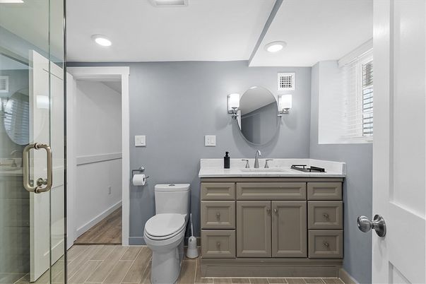 Bathroom, Dual Sink Vanities, Glass Shower, Interior, Recessed Lighting, Wood Texture Flooring