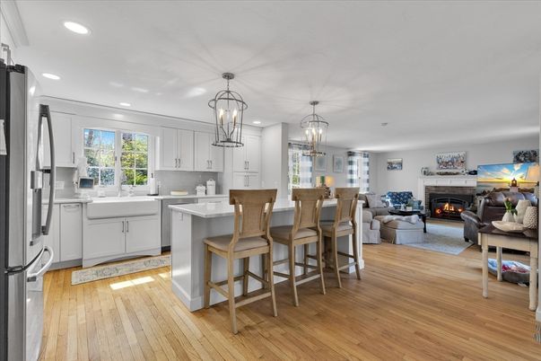 Chandelier, Fireplace, Interior, Kitchen, Living room, Pendant Lights, Recessed Lighting, Wood Texture Flooring