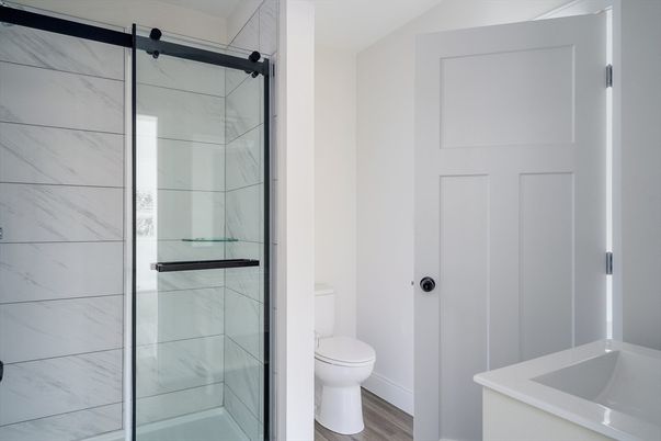 Bathroom, Glass Shower, Interior, Marble Walls, Wood Texture Flooring