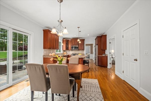 Dining room, Interior, Kitchen, Pendant Lights, Recessed Lighting, Stainless Steel Appliances, Wood Texture Flooring