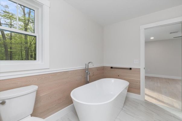Bathroom, Free Standing Baths, Interior, Marble, Recessed Lighting, Wood Texture Flooring