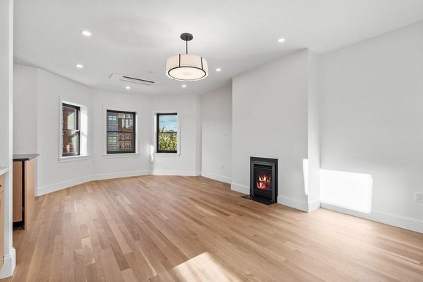 Empty room, Fireplace, Interior, Pendant Lights, Recessed Lighting, Wood Texture Flooring