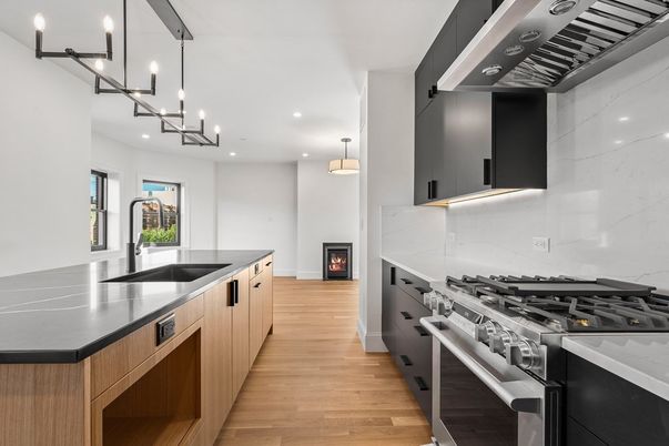 Interior, Kitchen, Marble Walls, Pendant Lights, Recessed Lighting, Stainless Steel Appliances, Wood Texture Flooring