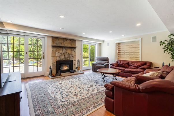 Fireplace, Interior, Living room, Recessed Lighting, Stone Walls, Wood Texture Flooring