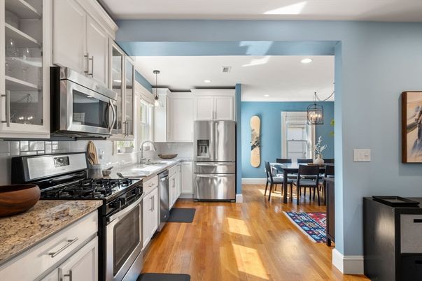 Chandelier, Dining room, Interior, Kitchen, Pendant Lights, Recessed Lighting, Stainless Steel Appliances, Wood Texture Flooring