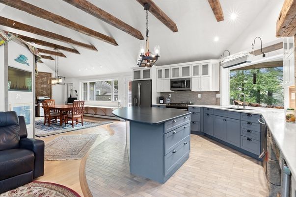 Chandelier, Dining room, Interior, Kitchen, Pendant Lights, Recessed Lighting, Stainless Steel Appliances, Wooden Beams, Wood Texture Flooring