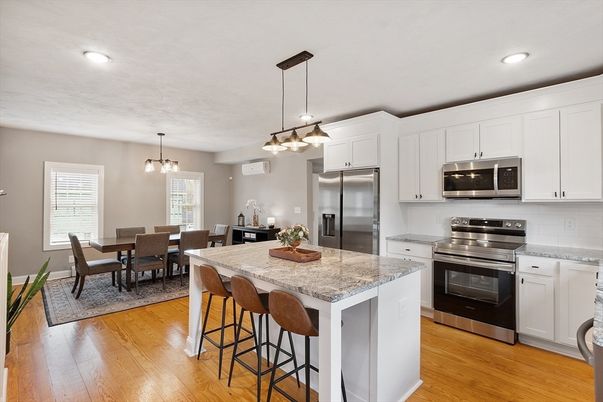 Dining room, Interior, Kitchen, Pendant Lights, Recessed Lighting, Stainless Steel Appliances, Wood Texture Flooring