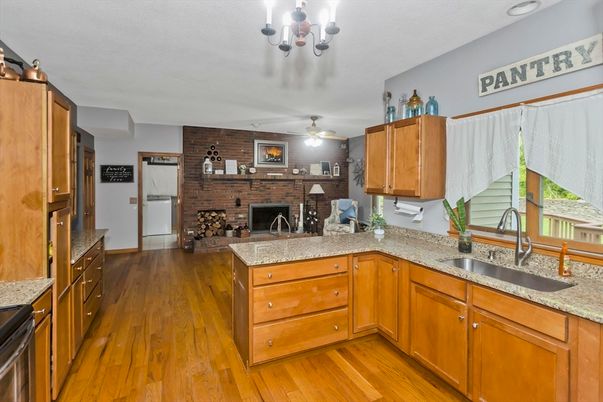 Chandelier, Fireplace, Interior, Kitchen, Stone Walls, Wood Texture Flooring
