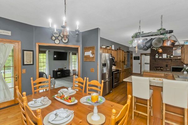 Chandelier, Dining room, Interior, Kitchen, Stainless Steel Appliances, Stone Walls, Wood Texture Flooring