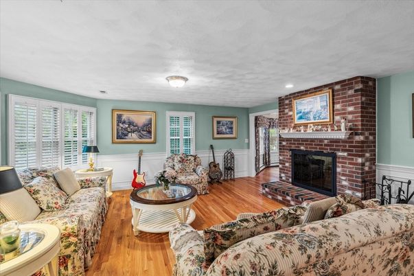 Fireplace, Interior, Living room, Recessed Lighting, Stone Walls, Wood Texture Flooring