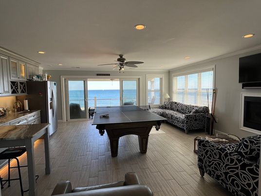 Fireplace, Game Room, Interior, Living room, Recessed Lighting, Water, Wood Texture Flooring