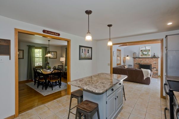 Dining room, Fireplace, Interior, Pendant Lights, Recessed Lighting, Stone Walls, Wood Texture Flooring