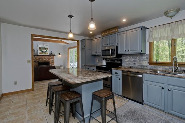 Fireplace, Interior, Kitchen, Pendant Lights, Recessed Lighting, Stainless Steel Appliances, Stone Walls