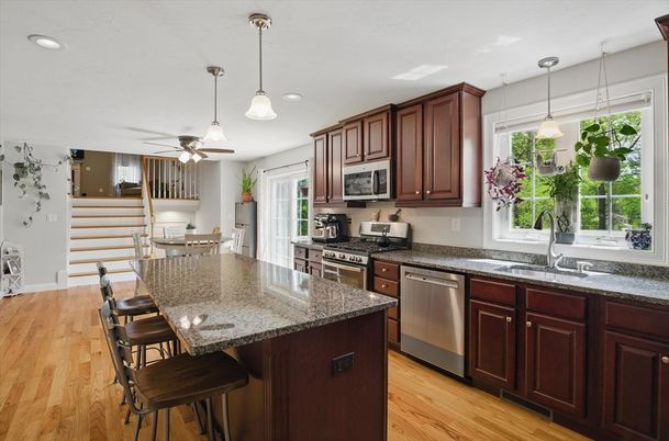 Dining room, Interior, Kitchen, Pendant Lights, Recessed Lighting, Stainless Steel Appliances, Wood Texture Flooring