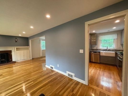 Fireplace, Interior, Kitchen, Recessed Lighting, Stainless Steel Appliances, Wood Texture Flooring
