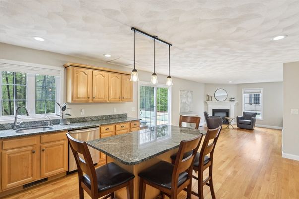 Fireplace, Interior, Kitchen, Living room, Pendant Lights, Recessed Lighting, Stainless Steel Appliances, Wood Texture Flooring