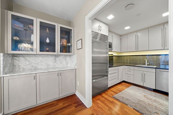 Interior, Kitchen, Marble Walls, Recessed Lighting, Stainless Steel Appliances, Wood Texture Flooring