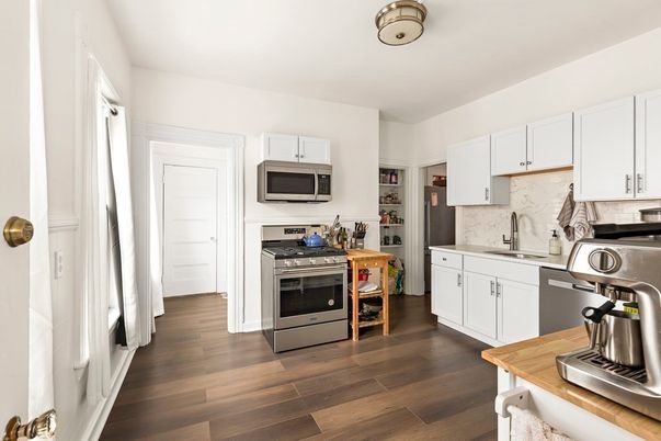 Interior, Kitchen, Marble Walls, Stainless Steel Appliances, Wood Texture Flooring