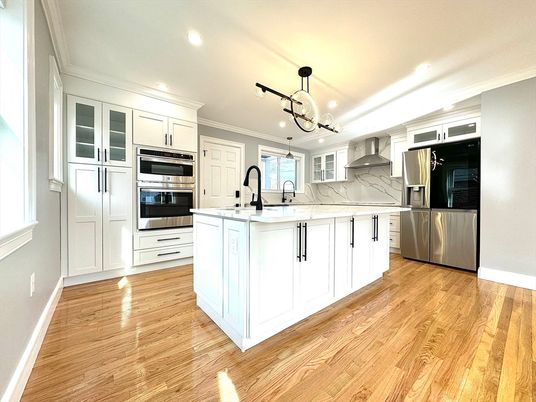 Interior, Kitchen, Marble Walls, Pendant Lights, Recessed Lighting, Stainless Steel Appliances, Wood Texture Flooring