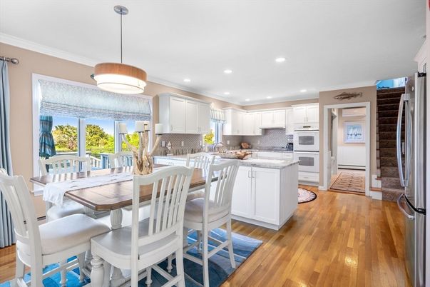 Dining room, Interior, Kitchen, Pendant Lights, Recessed Lighting, Stainless Steel Appliances, Wood Texture Flooring