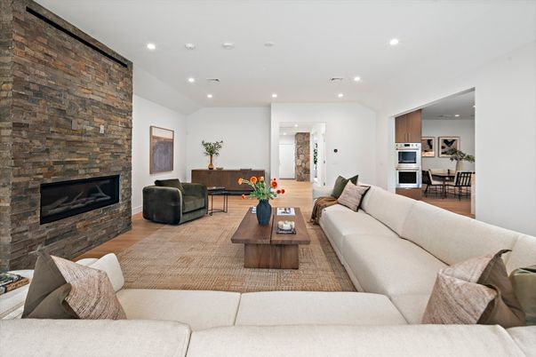 Dining room, Fireplace, Interior, Kitchen, Living room, Recessed Lighting, Stone Walls, Wood Texture Flooring
