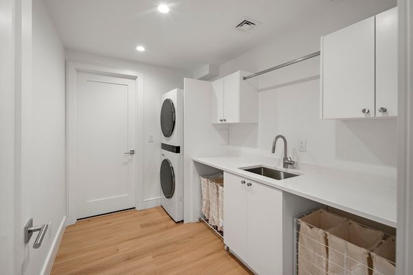 Interior, Kitchen, Recessed Lighting, Washer, Wood Texture Flooring